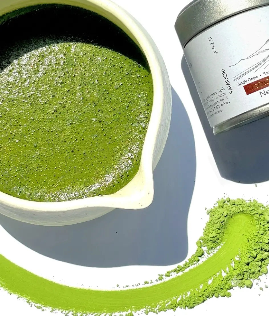 Freshly whisked FKRŌ ceremonial matcha in a chawan bowl, the vivid jade-green result of high L-theanine, first-harvest, shade-grown leaves
