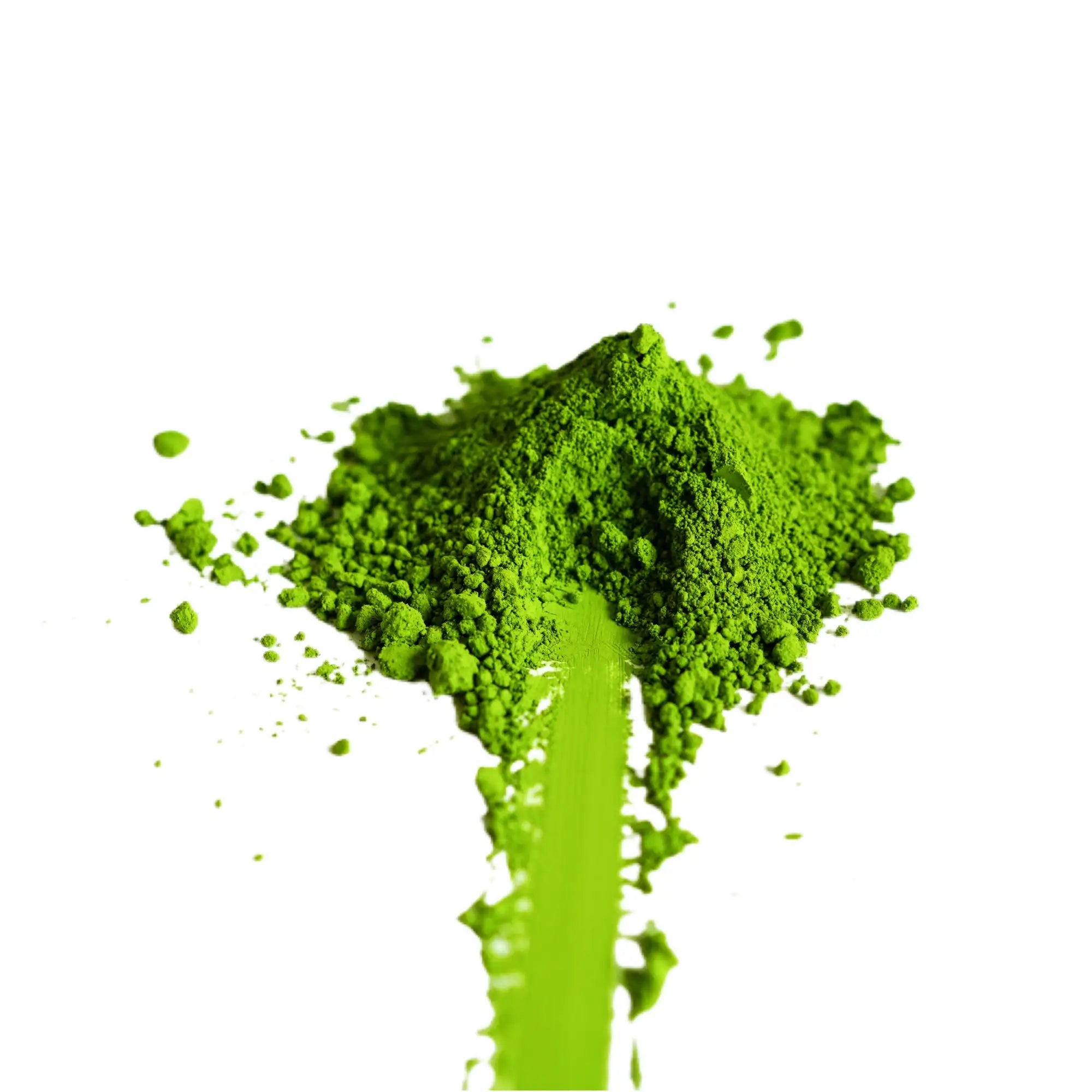A vibrant, finely ground green powder piled in a mound with some particles scattered around it.